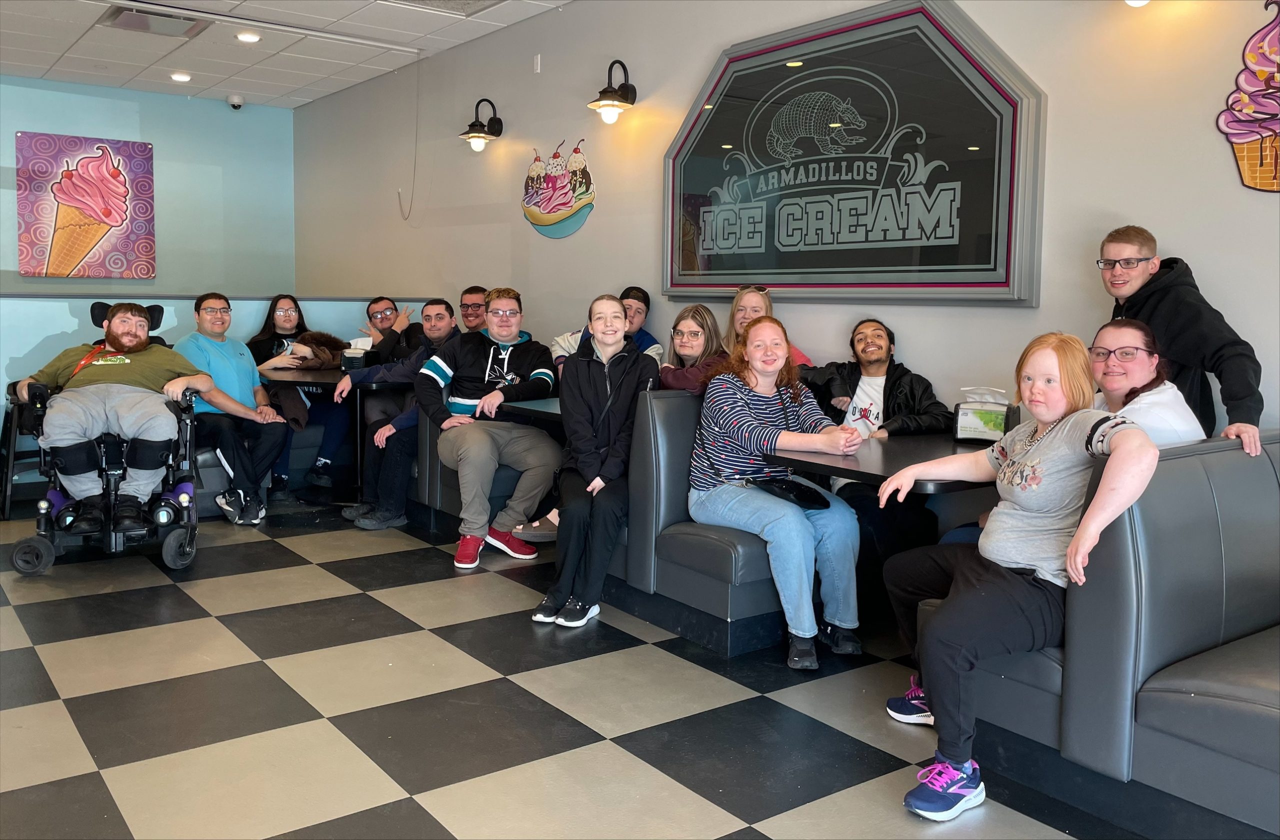Project SEARCH Black Hills alumni members seated at ice cream shop booths.